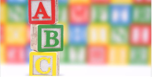 three wooden blocks with the letters A B C are stacked on top of each other